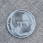 Серебряная монета с профилем Серебряная монета с профилем